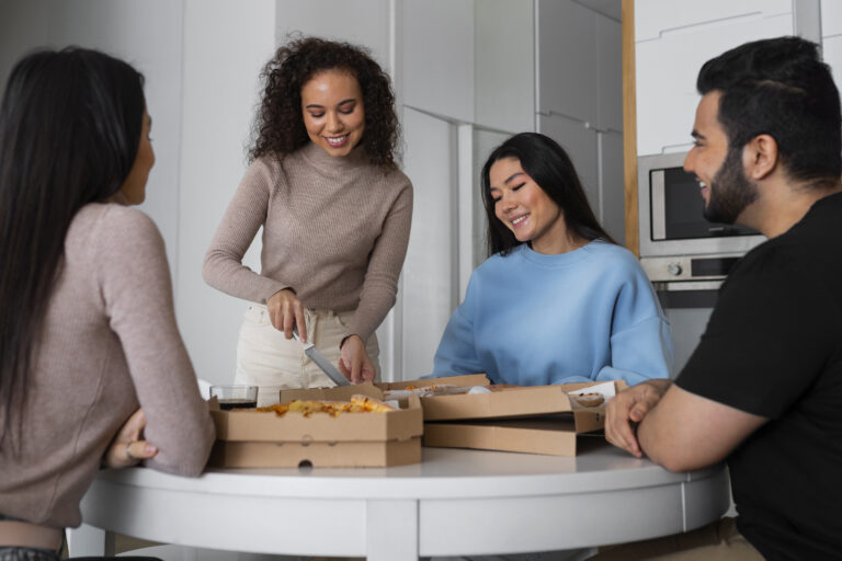 group-friends-eating-pizza-home-together